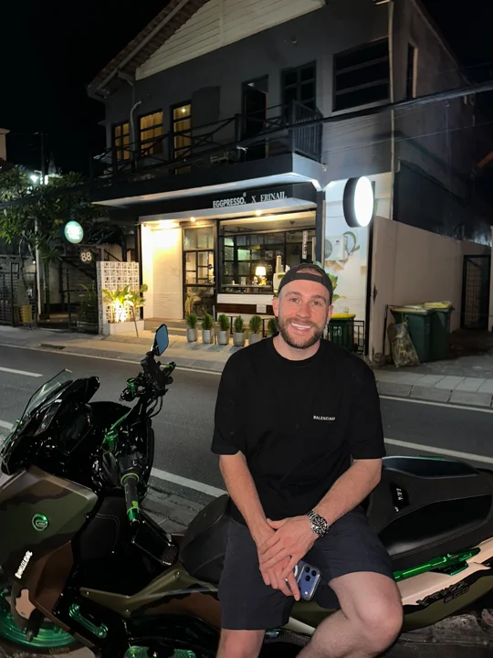 Night scooter portrait: black tee and shorts