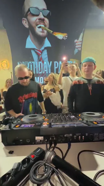 DJ booth beneath the birthday portrait