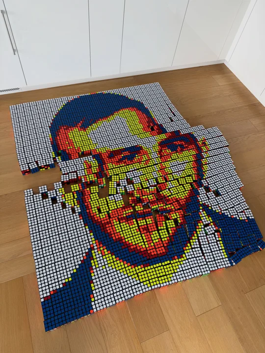 Rubik-cube portrait as a tangible milestone